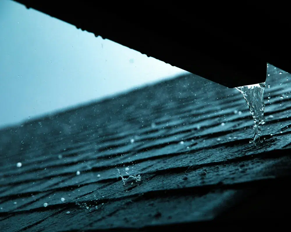 Hail and rain hitting a roof